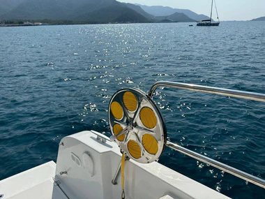 ULTRALINE flat rope reel system on a yacht with ocean in the background